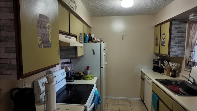 kitchen with a textured ceiling, light countertops, white appliances, and under cabinet range hood