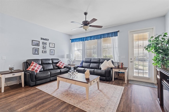 3304 Cat Brier Trl, Harmony, FL 34773 - living area featuring plenty of natural light, dark wood finished floors, and a ceiling fan