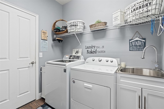 3304 Cat Brier Trl, Harmony, FL 34773 - laundry area with dark wood-style flooring, washing machine and clothes dryer, a sink, and cabinet space