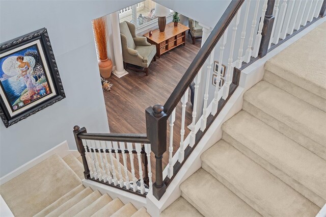 3304 Cat Brier Trl, Harmony, FL 34773 - stairway with baseboards and wood finished floors