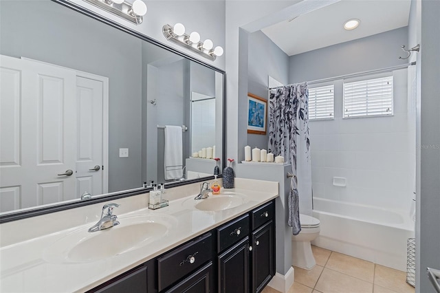 3304 Cat Brier Trl, Harmony, FL 34773 - full bathroom featuring toilet, shower / bath combo with shower curtain, a sink, and tile patterned floors