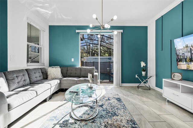 living area with baseboards, ornamental molding, and a notable chandelier