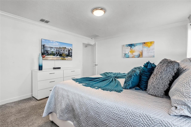 carpeted bedroom with baseboards, a textured ceiling, visible vents, and crown molding