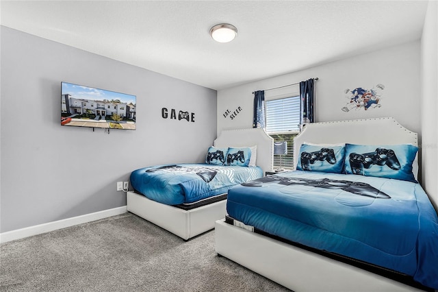 bedroom featuring carpet floors and baseboards