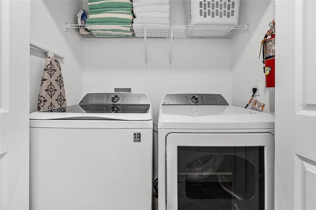 laundry room featuring washer and dryer and laundry area