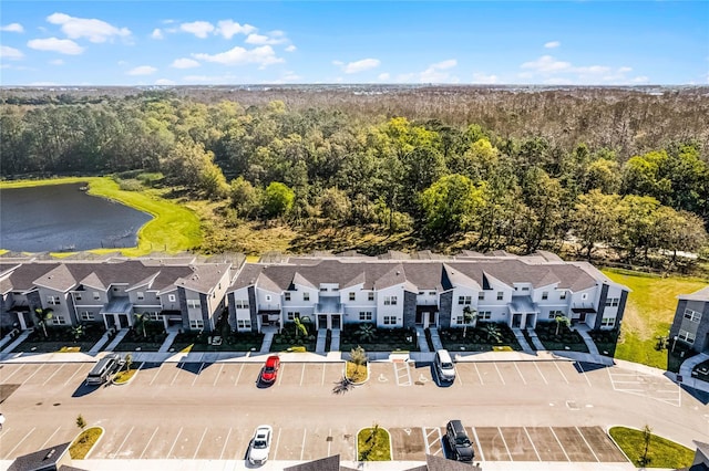 birds eye view of property with a residential view and a water view