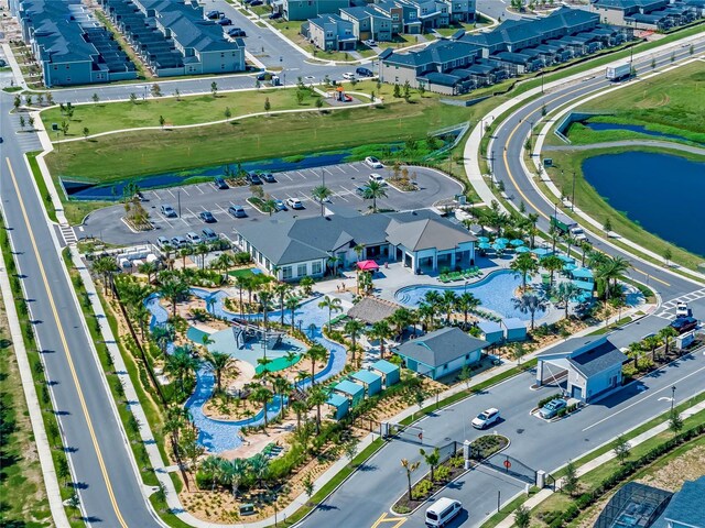 bird's eye view featuring a water view and a residential view