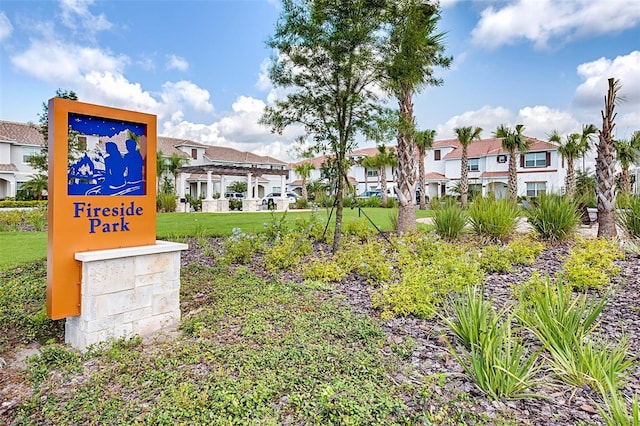 view of home's community featuring a residential view, a lawn, and a pergola