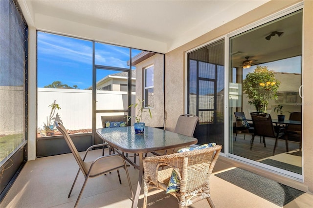 sunroom featuring a ceiling fan