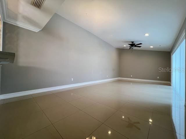 empty room featuring visible vents, baseboards, a ceiling fan, tile patterned flooring, and recessed lighting