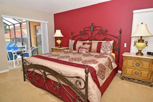 bedroom with carpet floors, access to outside, a sunroom, and baseboards