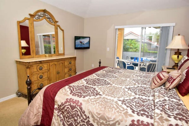 bedroom with baseboards, carpet flooring, and access to exterior