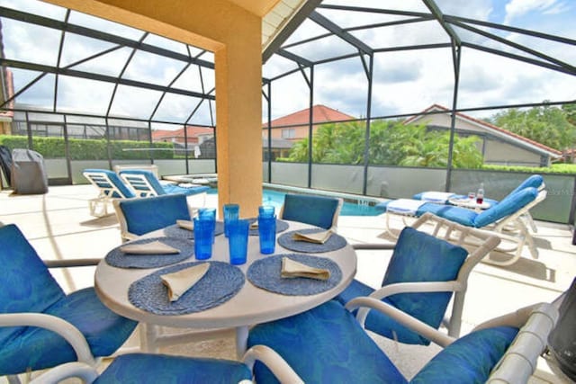 view of patio featuring glass enclosure, an outdoor pool, and an outdoor living space