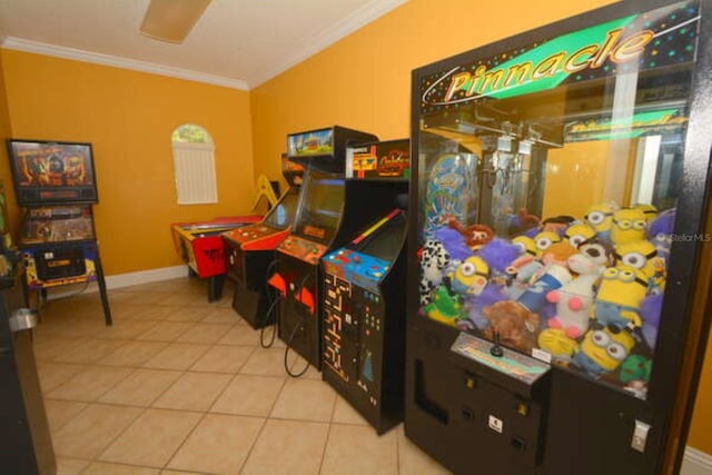 game room with baseboards, ornamental molding, and tile patterned floors