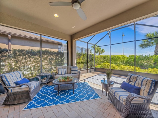 sunroom with a ceiling fan