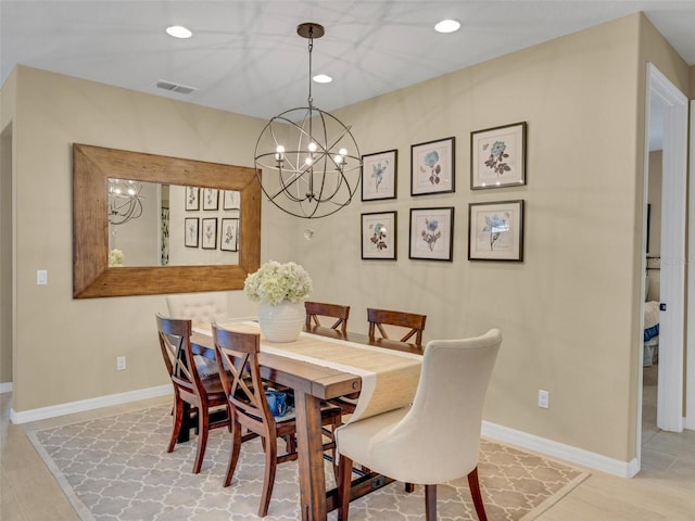 dining space with recessed lighting, visible vents, a notable chandelier, and baseboards