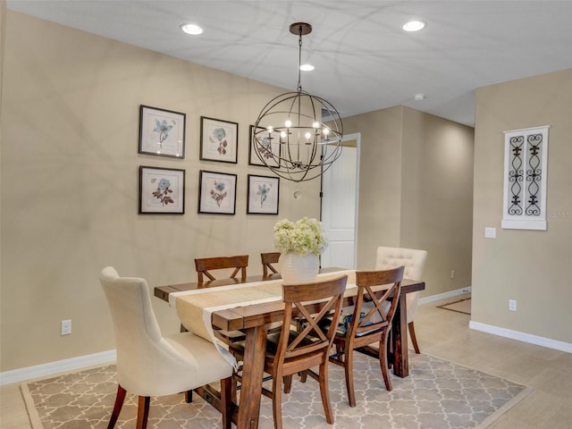 dining space with baseboards, a notable chandelier, and recessed lighting