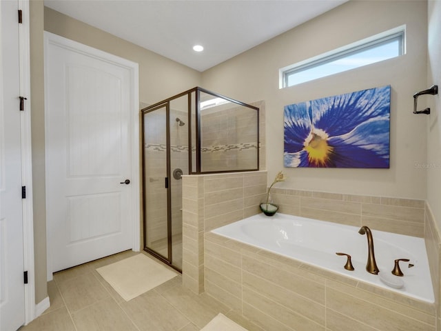 full bath featuring recessed lighting, a shower stall, a bath, and tile patterned floors