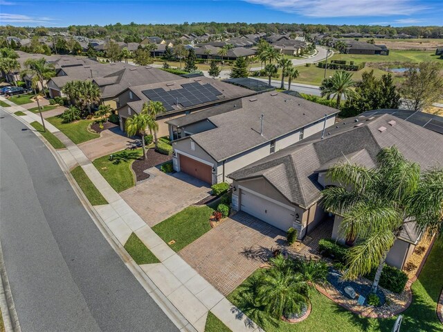 birds eye view of property with a residential view