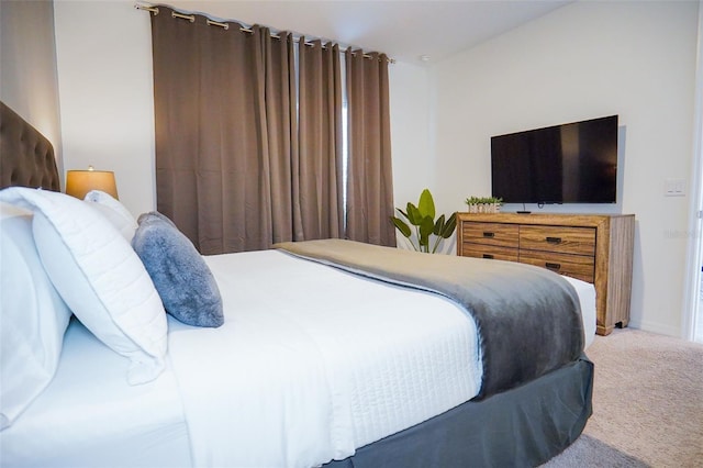 carpeted bedroom with baseboards