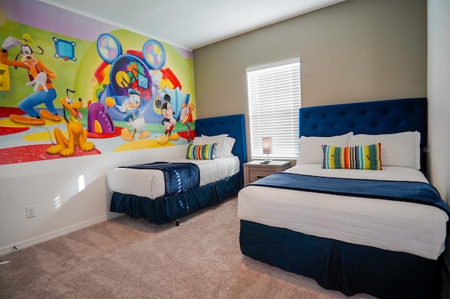 bedroom with carpet floors and baseboards