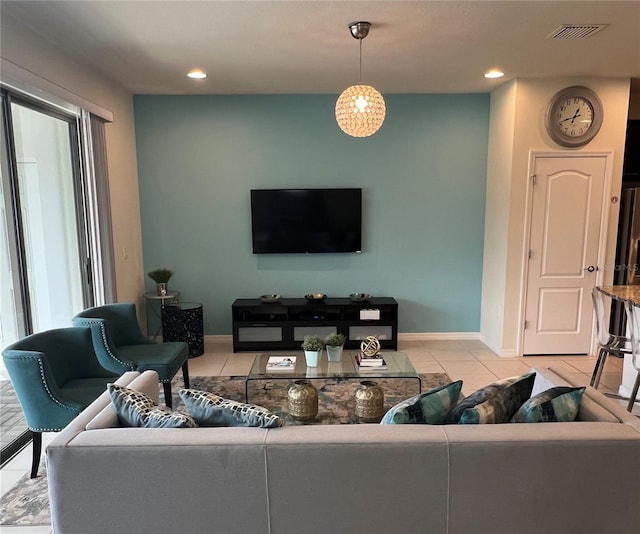 living room featuring light tile patterned floors, recessed lighting, visible vents, and baseboards