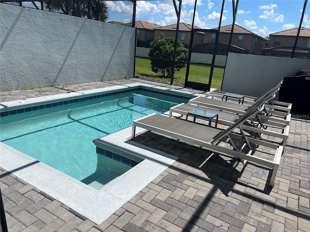 view of pool featuring a fenced in pool, glass enclosure, a patio, and fence