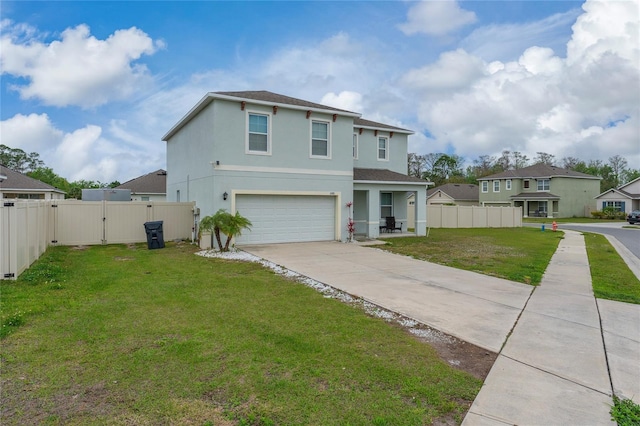 traditional-style home with stucco siding, a gate, fence, and a front yard