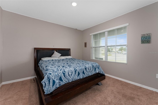 carpeted bedroom with baseboards