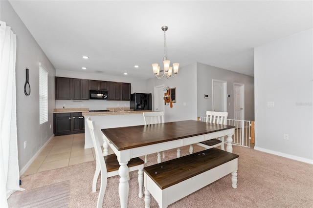 dining room featuring light tile patterned floors, baseboards, a notable chandelier, and recessed lighting