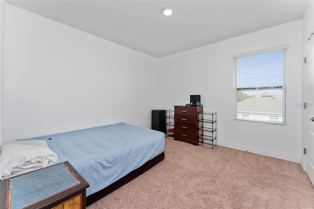 carpeted bedroom with baseboards