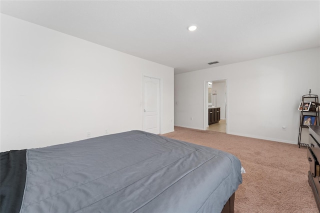 bedroom featuring recessed lighting, visible vents, light carpet, and baseboards