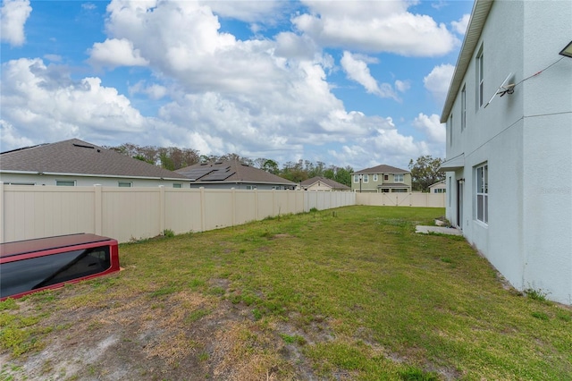 view of yard with a fenced backyard