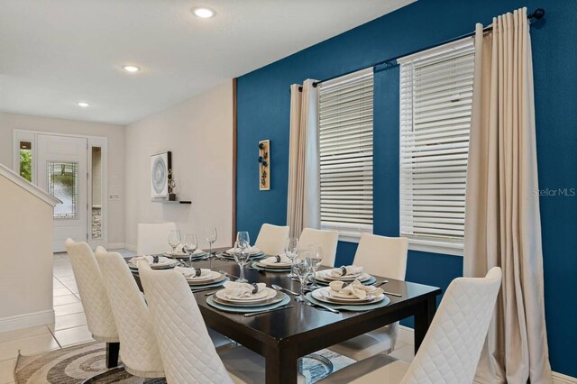 dining room featuring recessed lighting, baseboards, and tile patterned floors