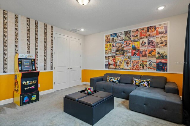 carpeted living room featuring recessed lighting, visible vents, and baseboards