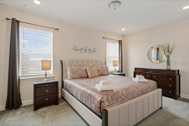 bedroom featuring light carpet, baseboards, and recessed lighting