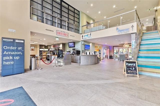 welcome area with stairway and visible vents