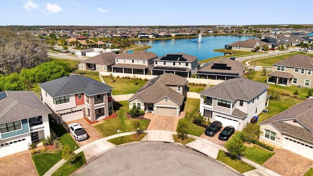 aerial view featuring a residential view and a water view