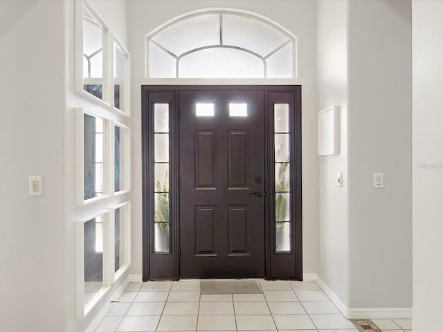 1718 Golfview Dr, Kissimmee, FL 34746 - entryway featuring light tile patterned floors and baseboards