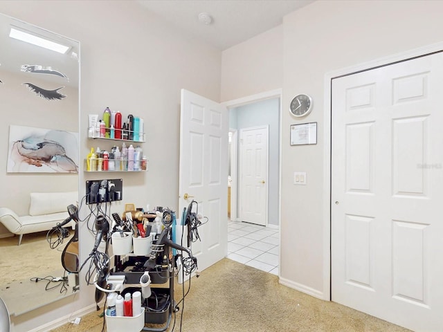 1718 Golfview Dr, Kissimmee, FL 34746 - workout area featuring carpet, tile patterned flooring, and baseboards