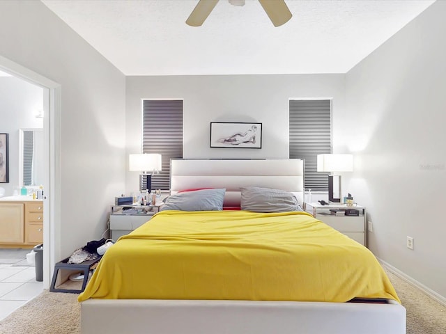 1718 Golfview Dr, Kissimmee, FL 34746 - bedroom featuring light carpet, baseboards, a ceiling fan, and ensuite bathroom