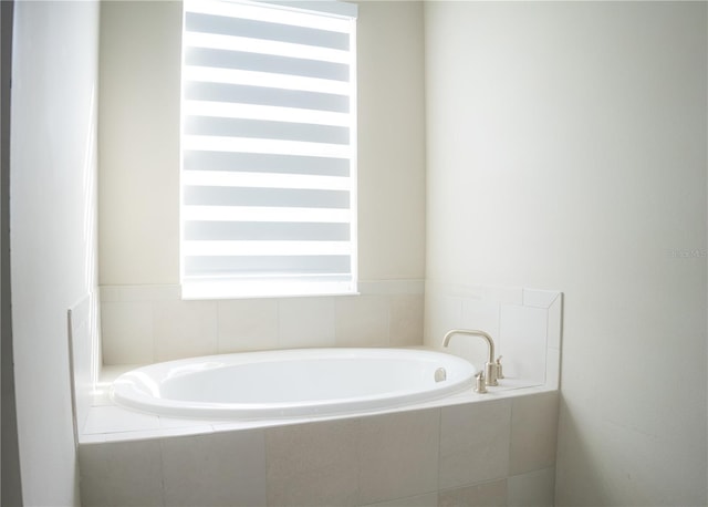 full bathroom featuring radiator and a bath