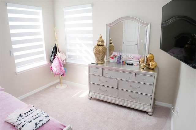 carpeted bedroom with baseboards