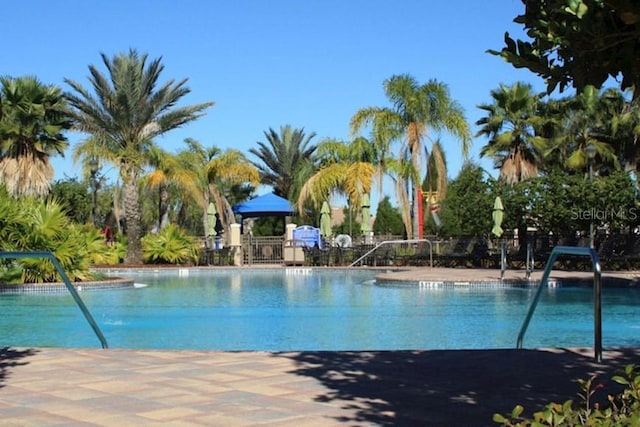 community pool featuring fence