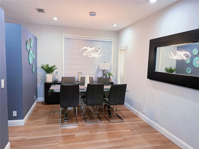 dining area featuring recessed lighting, wood finished floors, visible vents, and baseboards