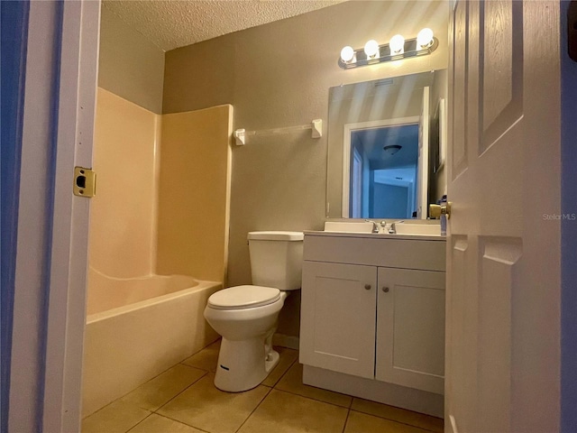 full bathroom featuring toilet, tub / shower combination, a textured ceiling, vanity, and tile patterned flooring