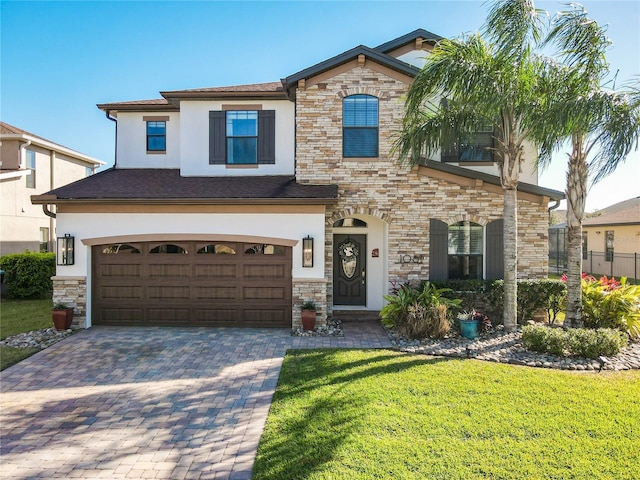 view of front of property featuring a garage, decorative driveway, a front lawn, and stucco siding