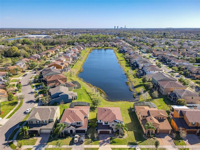 bird's eye view featuring a water view and a residential view