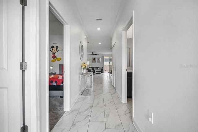 corridor featuring recessed lighting, baseboards, marble finish floor, and crown molding