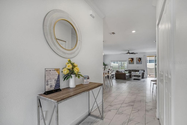 corridor featuring recessed lighting, visible vents, and marble finish floor